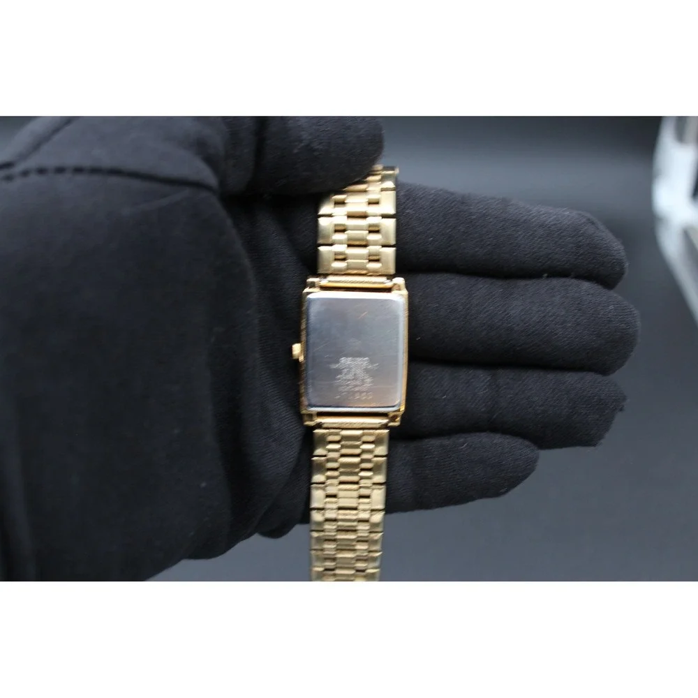 Vintage Seiko V701-5E49 Quartz Tank Watch Black Dial Gold Tone 25mm